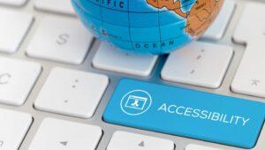A partial image of a globe on top of white computer keyboard keys with a sky blue button that says Accessibility.